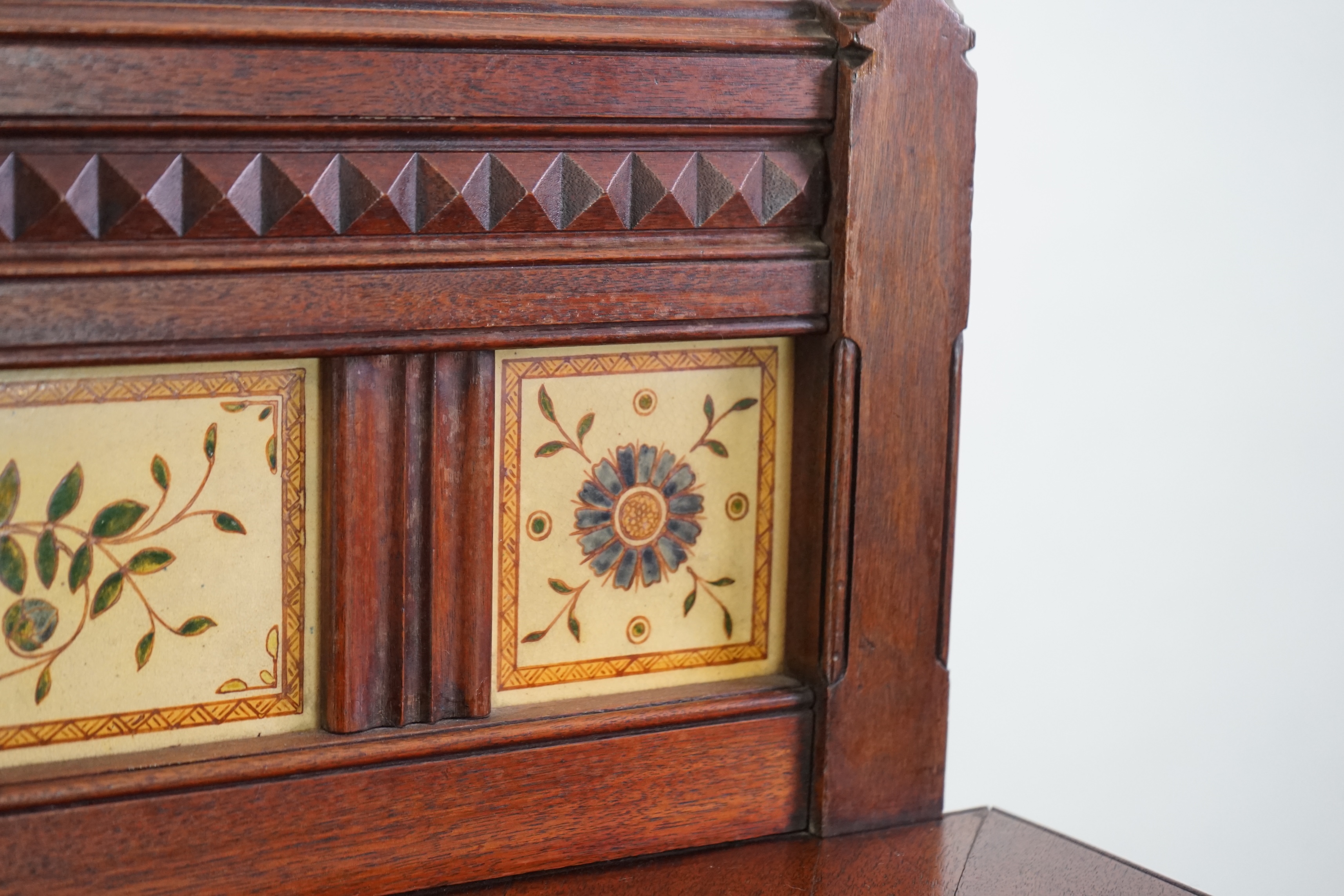 A Victorian Aesthetic Period walnut fall front desk attributed to Bruce James Talbert (1838-1881)